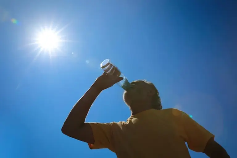 older person preventing smartphone overheating outdoors