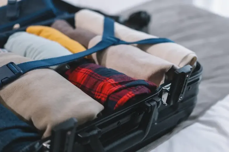 open suitcase minimalist packing tips