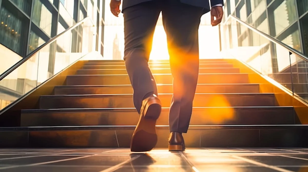businessman taking stairs office building daylight
