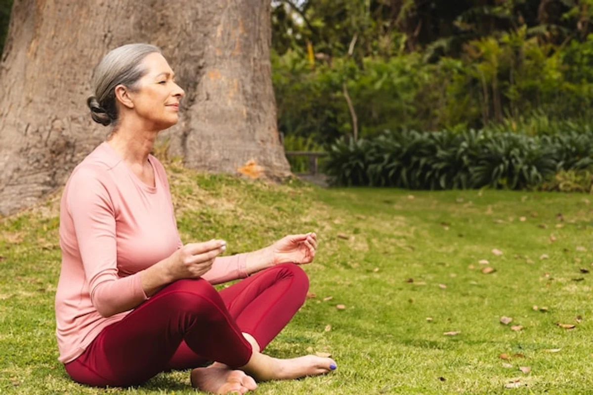 gentle exercise senior woman stretching park
