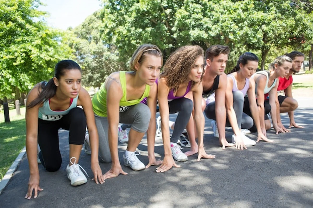 group of adults walking in city park Germany fitness activity