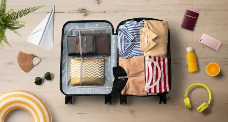 packing suitcase summer vacation essentials flat lay