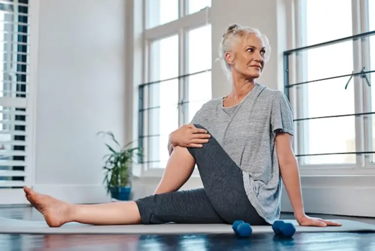 flexible mature woman stretching daily routine