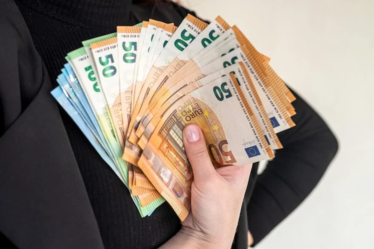 happy person saving money at home germany
