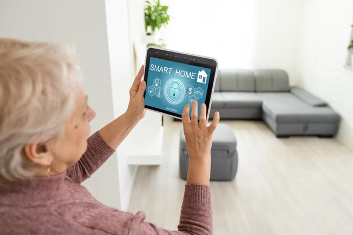 senior using smart home technology kitchen