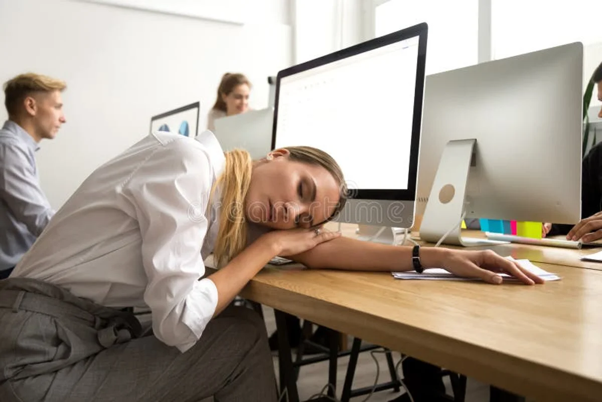 overworked tired person modern office desk Germany