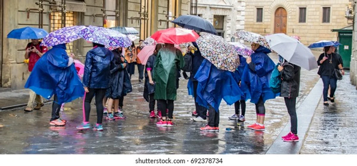 people wearing stylish rain ponchos in a German city
