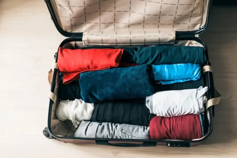 packing suitcase efficiently vacation minimalist