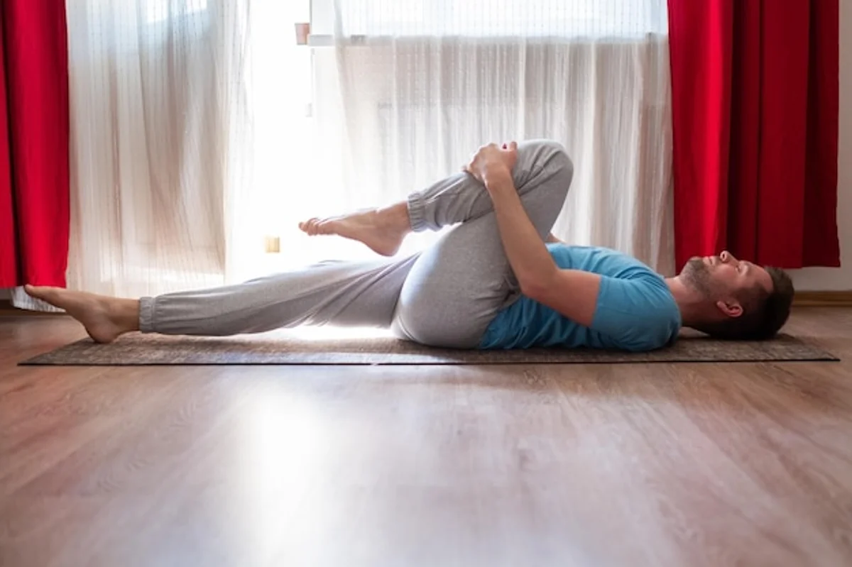 man practicing breathing exercise for back pain relief