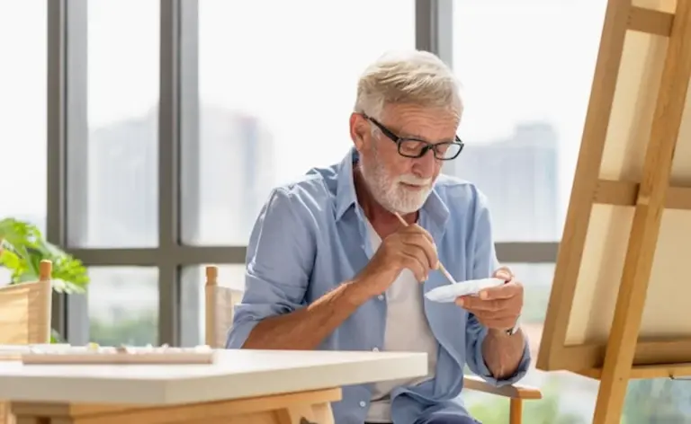 senior adult starting painting hobby at home creative leisure