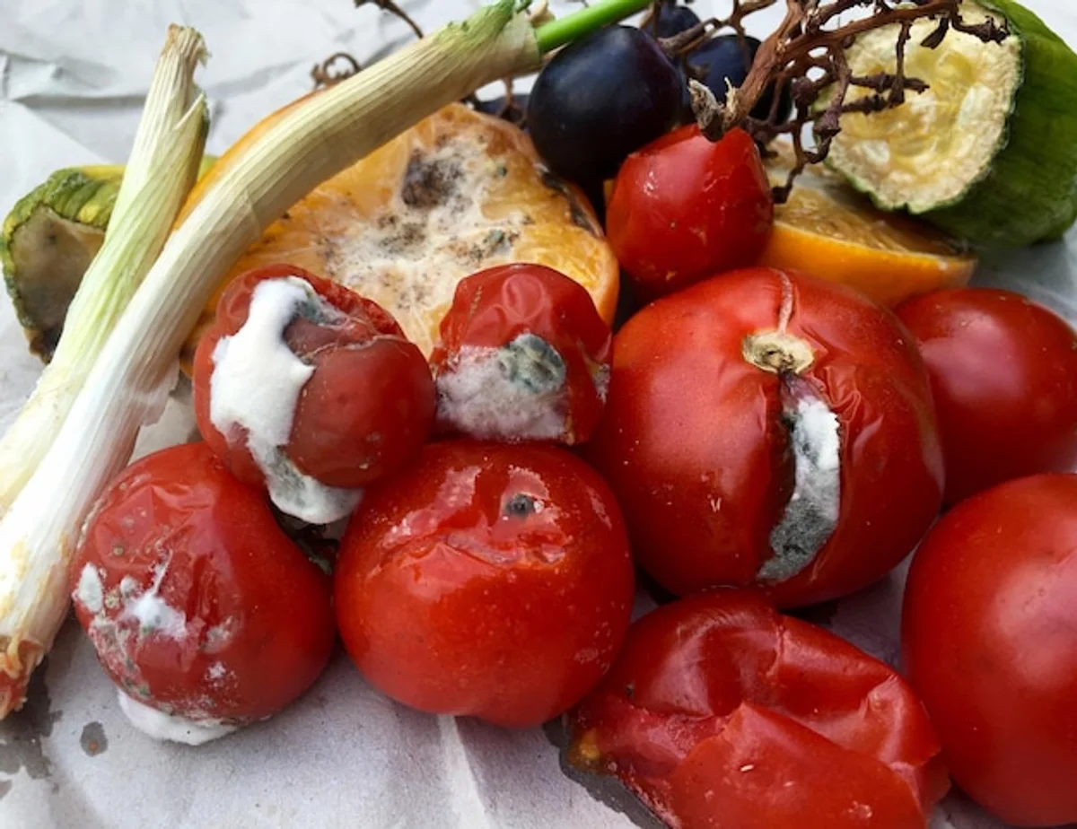 colorful vegetable scraps for soup on cutting board