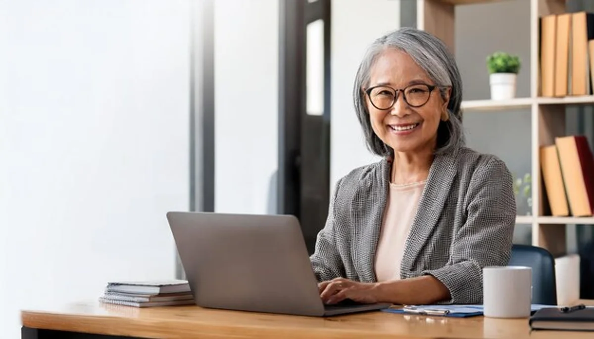 senior working on laptop home office productivity