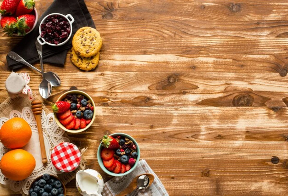 homemade muesli ingredients flat lay on rustic kitchen table