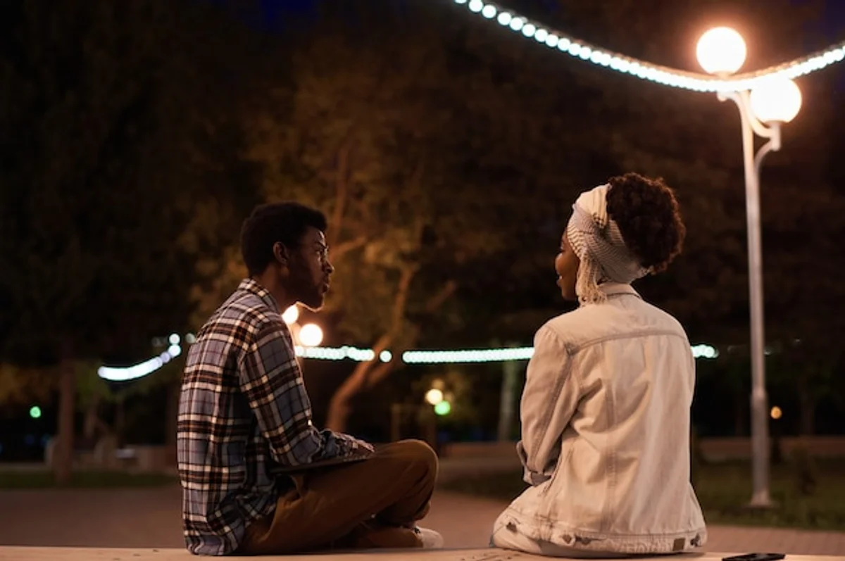 couple talking on park bench romantic conversation authentic