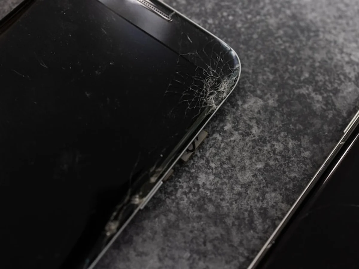 close up smartphone screen scratch repair home