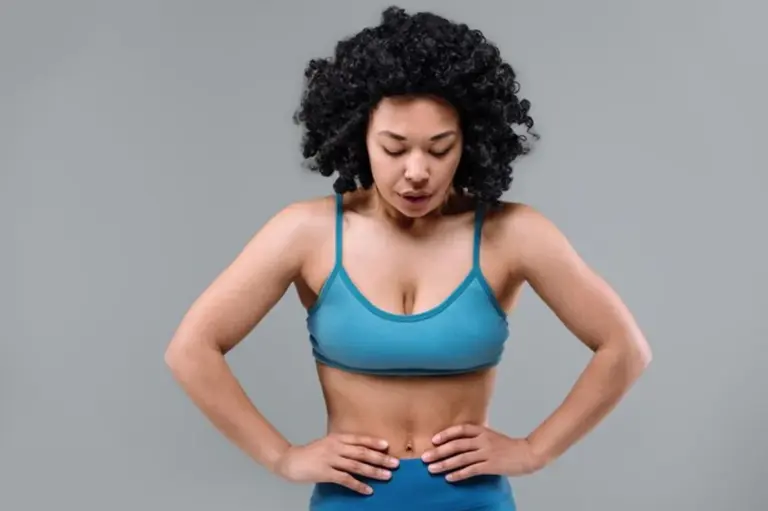 fit woman deep breathing workout gym