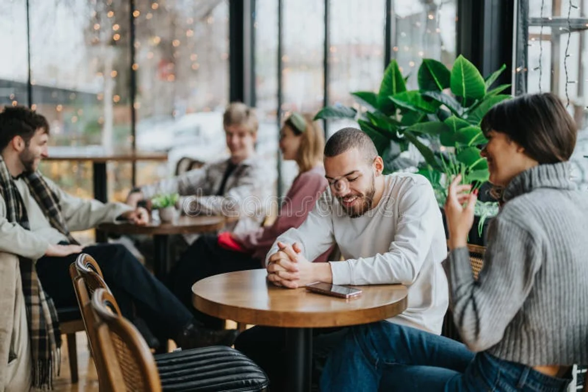 friends having honest conversation at coffee table, cozy, natural light