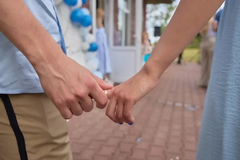 close up couple's hands gentle touch connection emotion