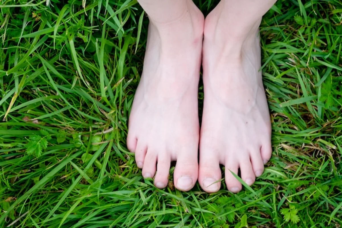 barefoot feet close up grass Germany
