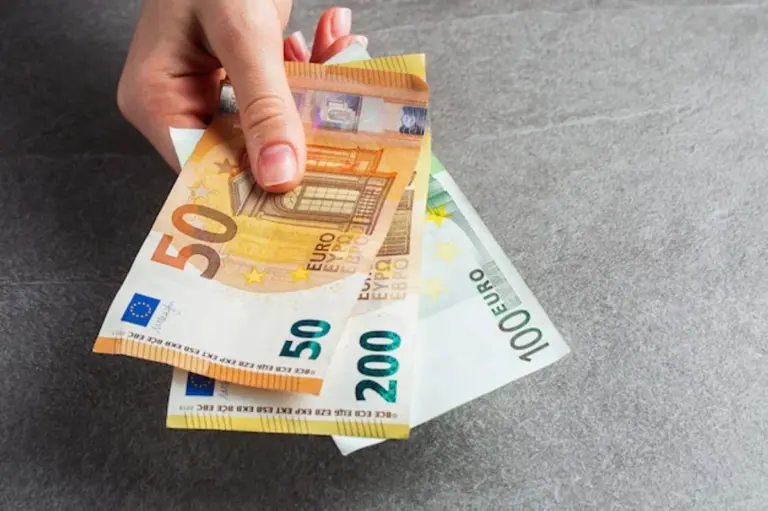 German woman counting euro cash wallet home