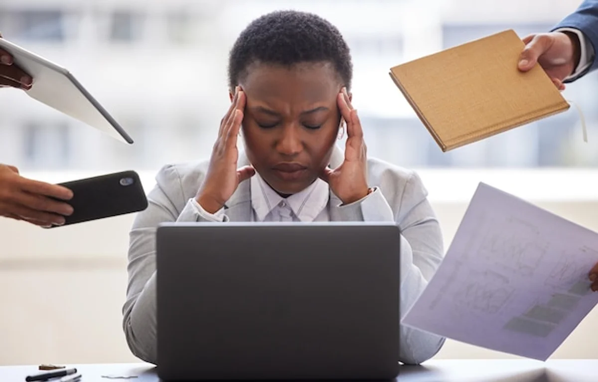 overwhelmed office worker email meeting productivity