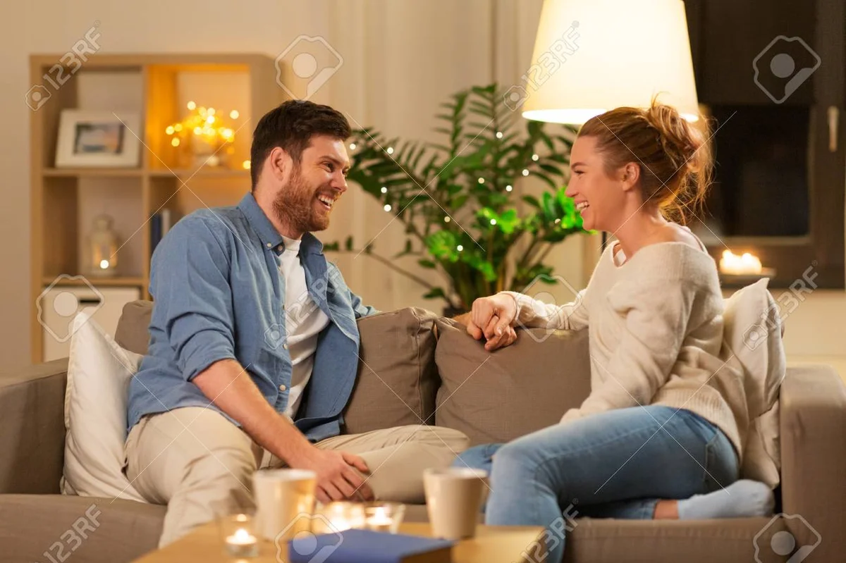 couple talking honestly at home, evening, candid moment