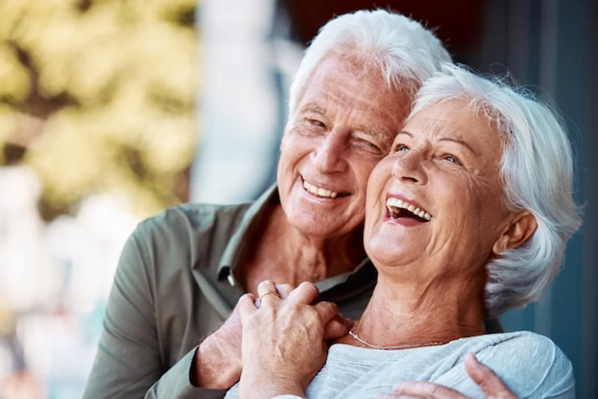 german couple laughing talking at home natural joyful