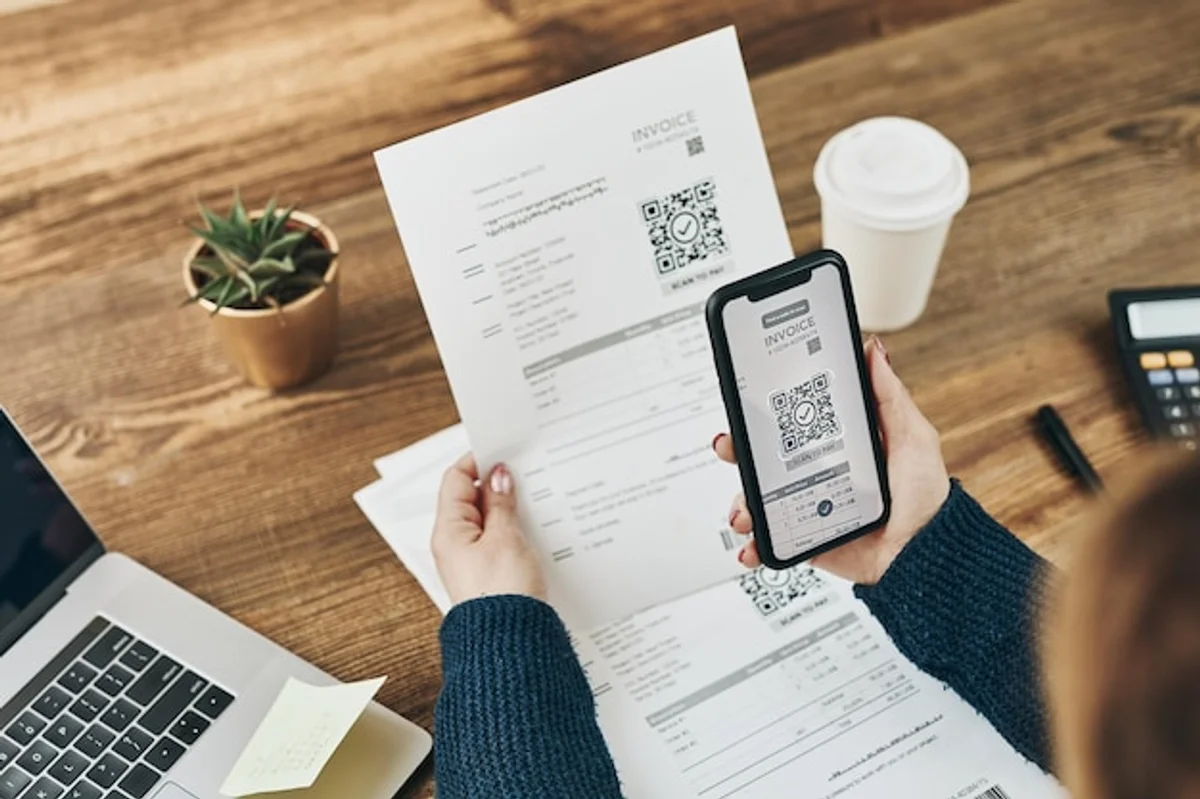 smartphone scanning receipt home office organization