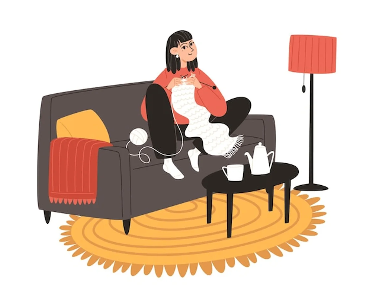 relaxed person painting or drawing at home in the evening