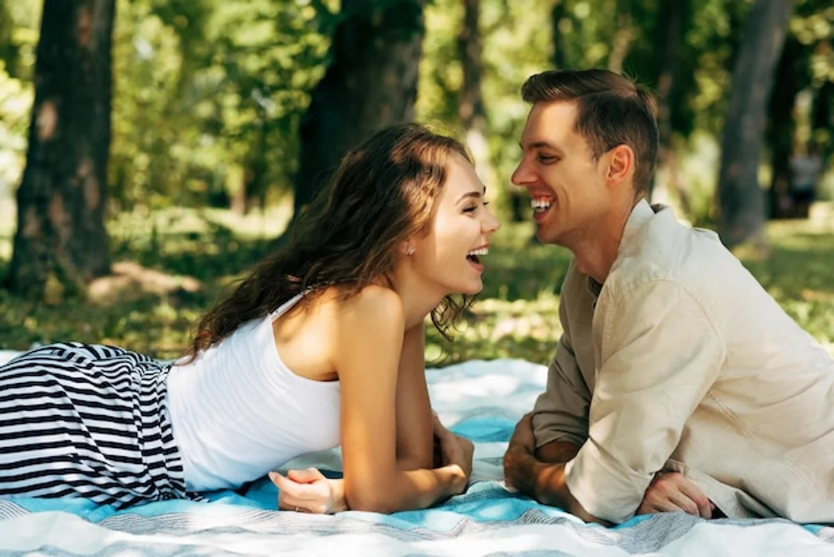 couple laughing together outside sunny day