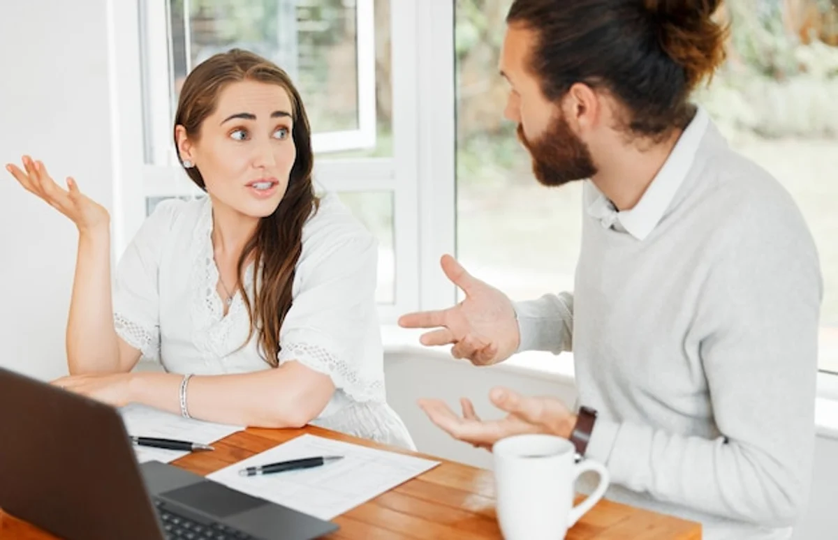 worried person looking at bank account statements