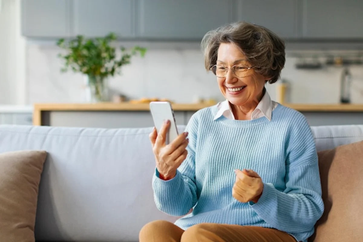 middle aged woman relaxed phone call dating app living room