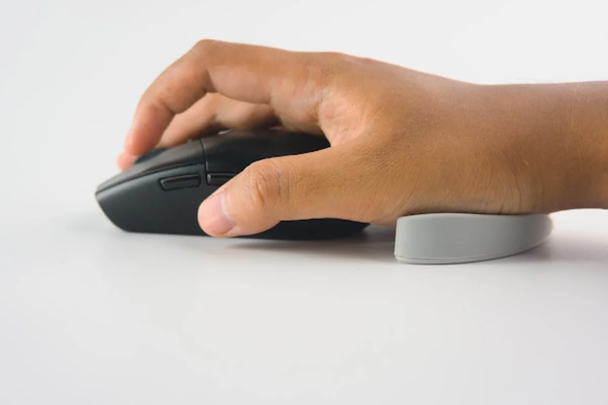 hands using wireless mouse office ergonomics productivity