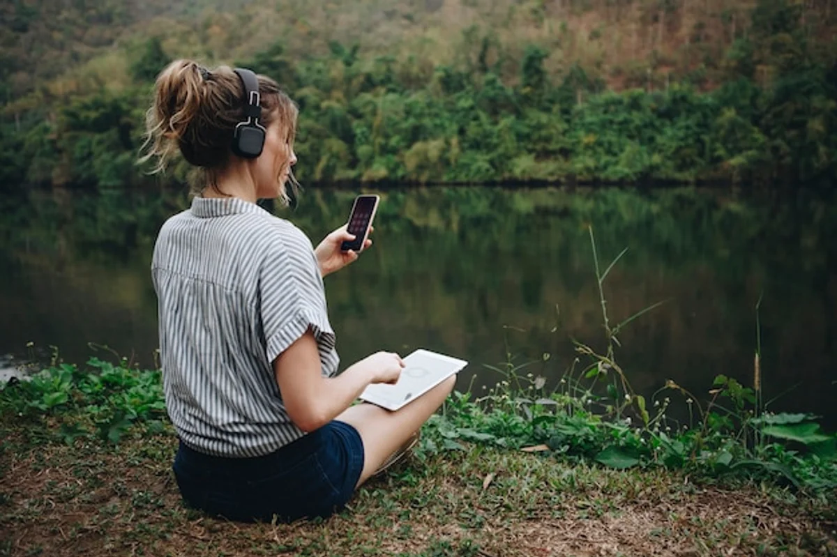 person enjoying peace after turning off smartphone nature