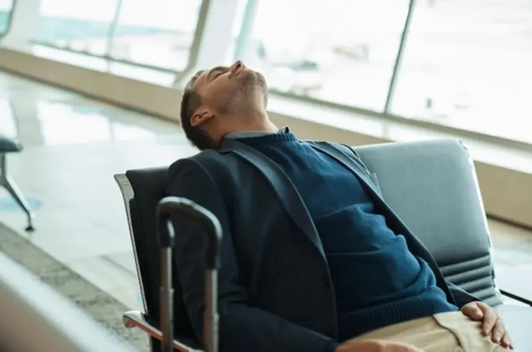 exhausted business traveler after long flight