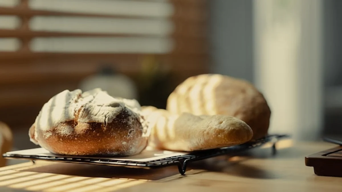 homemade sourdough bread with ingredients on table