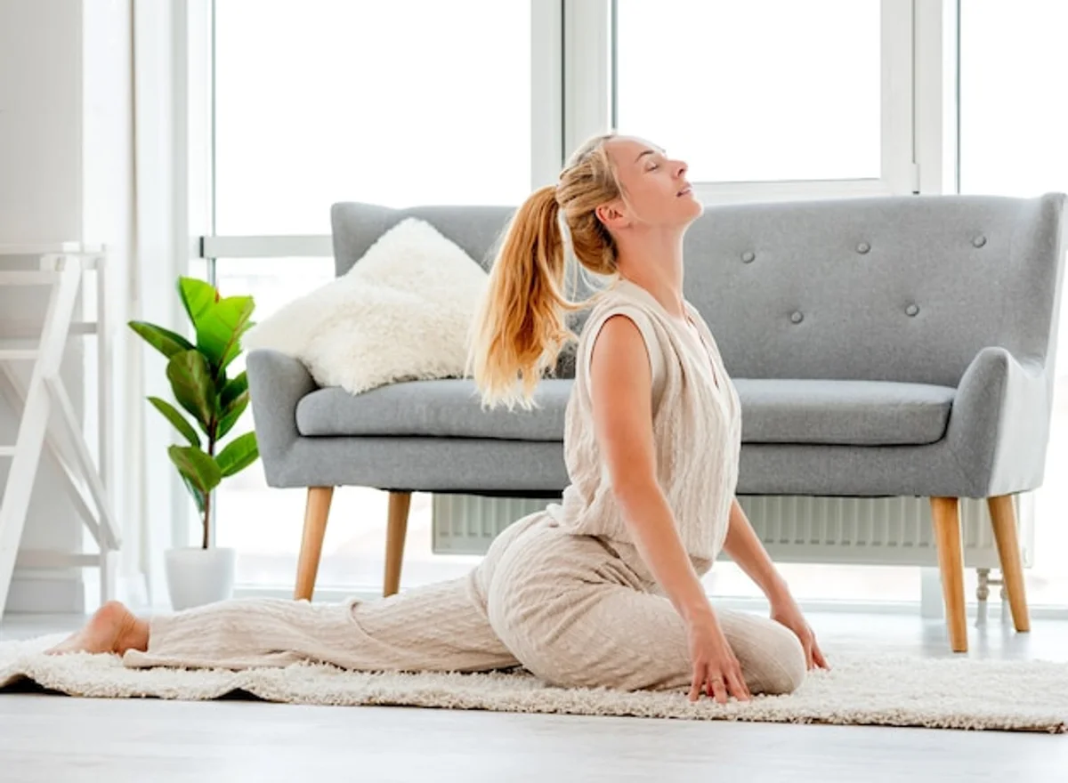 woman stretching morning sunlight living room