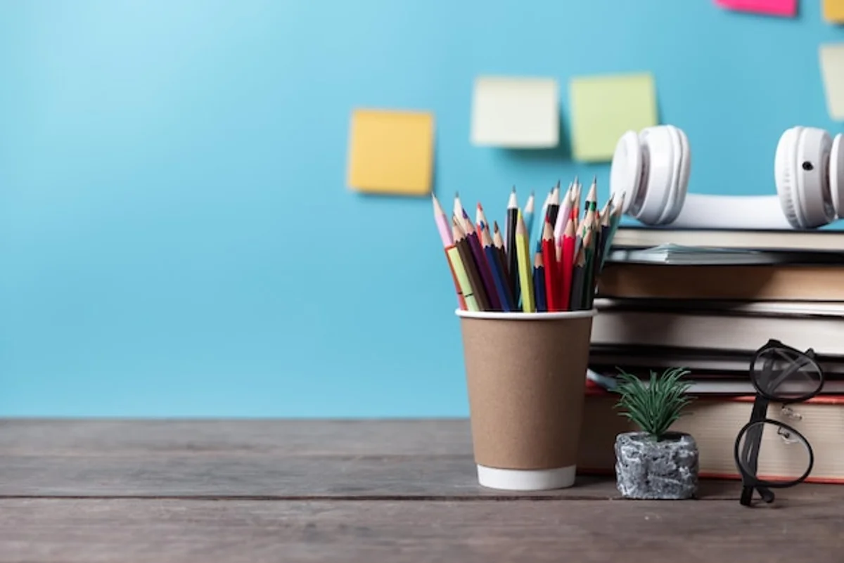 old colored pens on desk creative workspace