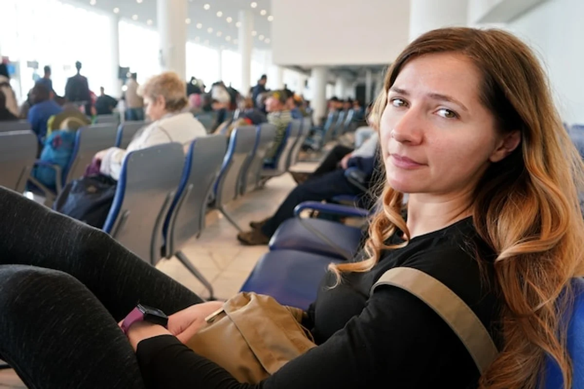 exhausted traveler at airport early morning